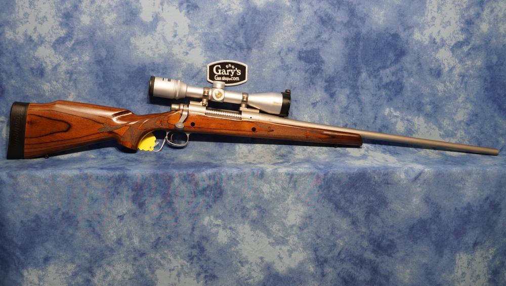 USED REMINGTON MODEL 700 STAINLESS LAMINATE 300 WIN MAG W/NIKON